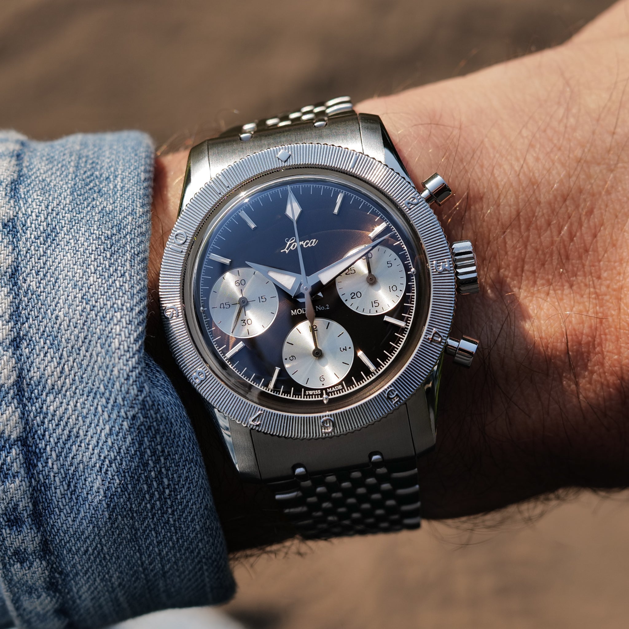 Lorca Model No.2 Chronograph golden gray dial on wrist lifestyle shot. Swiss manual movement. 100m 38mm quiet luxury.